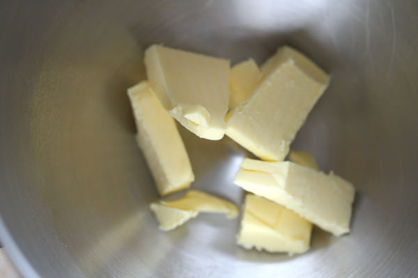 In a mixing bowl add in butter.