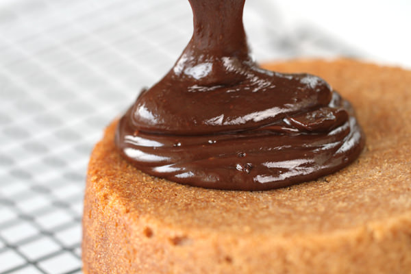 Pour melted chocolate on top of the cake.