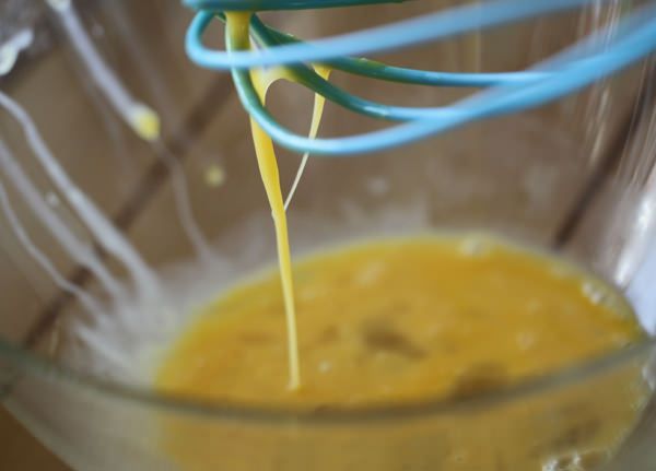 Lightly beat the egg.