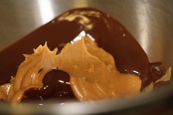 Add in peanut butter into melted chocolate.