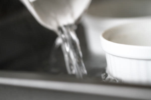 Arrange in a baking tray and fill with boiling water half way up.